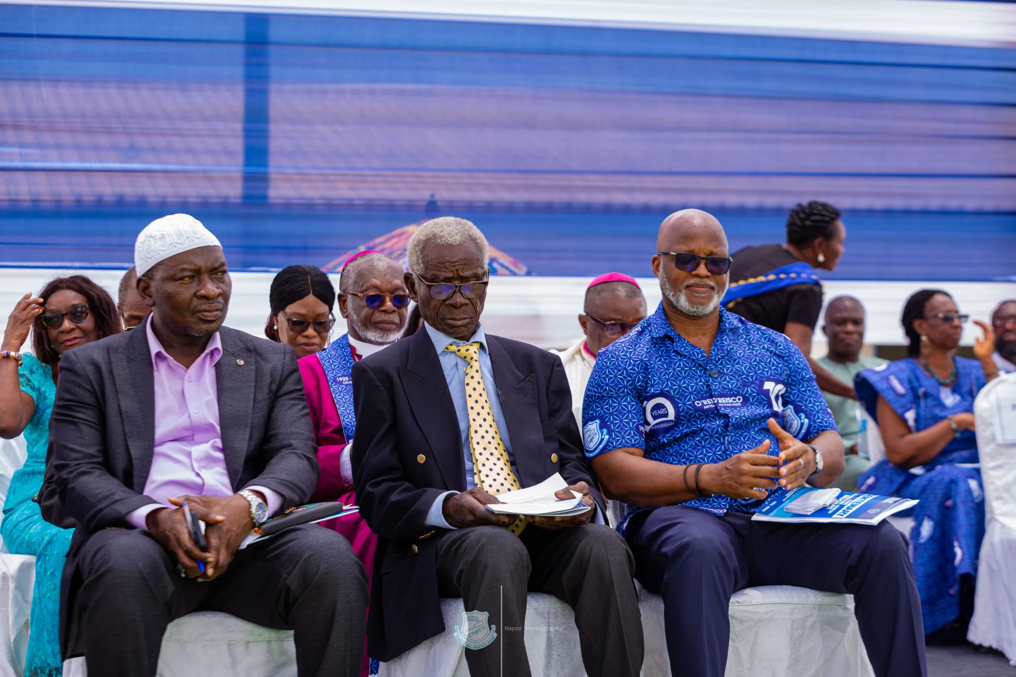 Older O’Reilly alumni seated together at a centenary gathering
